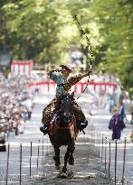 Archer on horseback in action to mark anniv. of shrine founder's death