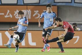 Kashima's Kanazaki scores against Kawasaki in J-League