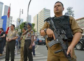 Jakarta in aftermath of gun and bomb attack