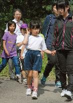 Evacuee children attend schools in Yakushima