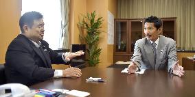 Japan's Olympics minister speaks with retired rugby star