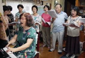 Hiroshima A-bomb survivor joins choral group before U.S. visit