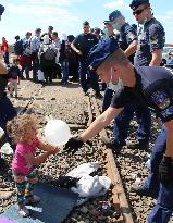 SNAPSHOT: Refugees making difficult journeys