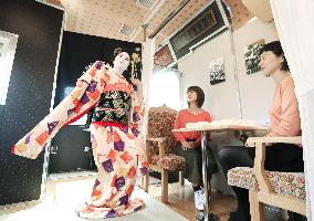 Geisha performance in local train car