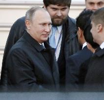 Putin arrives in Japan for summit with Abe