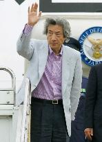 Koizumi leaves for G-8 summit in Scotland