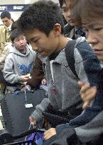 12-yr-old boy returns home alone from tsunami disaster