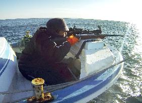 Hunter ready to shoot sea lion off Hokkaido, northern Japan