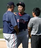 Japanese pitcher Uehara of Red Sox speaks with manager Farrell