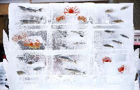 Frozen fish on display at Sapporo Snow Festival