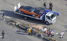 Car plows into spectators at drift event in southwest Japan