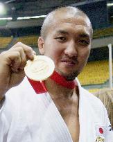 Suzuki wins 100-kg title at world judo championships