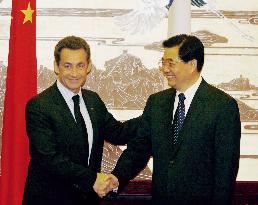 French president urges China to revalue currency