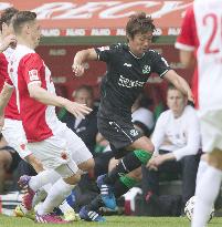Hannover's Japanese MF Kiyotake in action against Augsburg