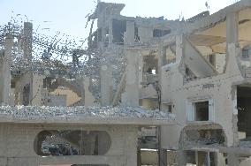 Bomb-ravaged buildings lie neglected in Gaza