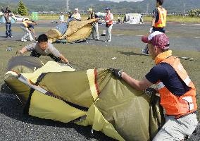 Tent community closed in quake-hit town