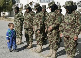 Kid 'reviews' Afghan female military trainees