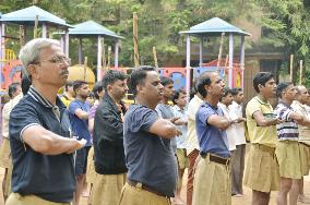 Hindu nationalist group members salute at rally in Mumbai