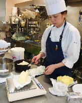 Pastry chef weighs lump of butter amid supply shortage