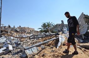 Man walks around destroyed homes in Gaza