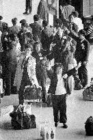 Japanese "war orphans" wave goodbye at Narita airport