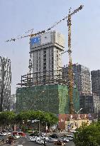 Beijing woman's house changing into commercial building