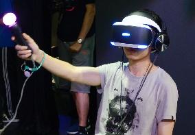 Chinese man tries Morpheus VR headset at ChinaJoy 2015