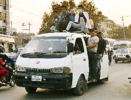 Overcrowded vehicle driven in Kathmandu amid scant public transport