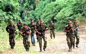 Aceh independence group guerrillas march in training