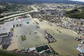 Part of western Japan city flooded following torrential rain