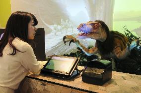 Dinosaur robot at hotel reception desk