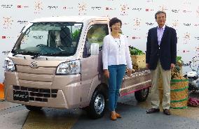 PM Abe's wife with truck remodeled for women farm workers