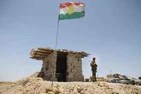 Kurdish regional gov't flag fluttering in northern Iraq