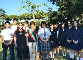 Japanese high school students plant cherry tree at pope's summer retreat