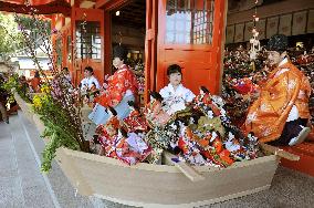 Dolls sent to sea to pray for girls' happiness