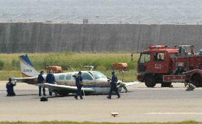 Small plane belly-lands at Kobe airport