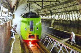 Firefighters douse train with water in Seikan Tunnel disaster drill