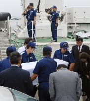 Fisherman's body returns to Japan