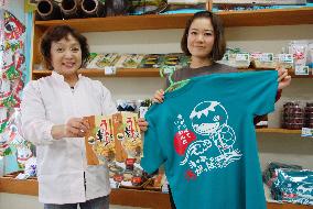 Staff of new island tourist facility show goods