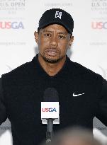 Woods looks disappointed after 1st round of U.S. Open