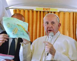 Pope Francis visits refugee camp, takes 12 Syrians back with him