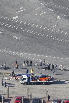 Car plows into spectators at drift event in southwest Japan