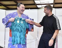 Yokozuna Hakuho and ex-Germany striker Podolski