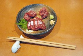Fresh raw whale meat served at restaurant in Tokyo's Tsukiji Outer Market