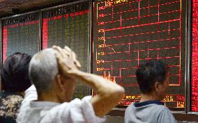 Shanghai stocks tumble more than 8%