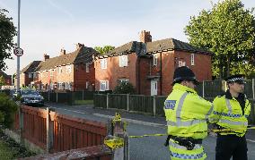 Police stand guard near house of suspected terrorist in Manchester