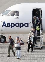 Ex-residents of Russian-held isles return home
