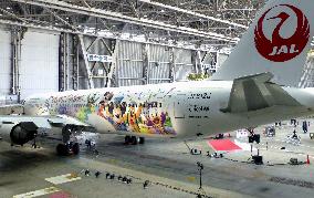JAL unveils plane painted with Disney characters