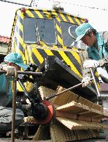 Snow-brushing gear set on street cars in Sapporo