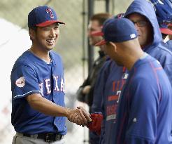 Rangers pitcher Fujikawa shakes hands with teammate